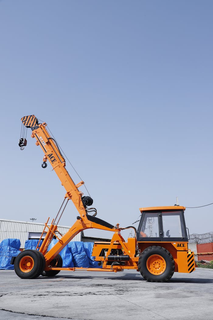 stats-img Orange ACE hydraulic crane with extended boom in Faridabad, India